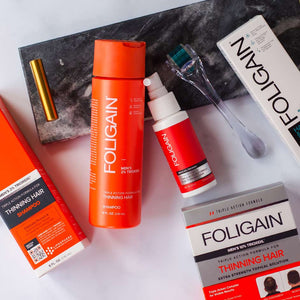 FOLIGAIN洗髮精、頭皮外用護理產品與頭皮滾輪連同包裝一併展示